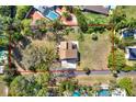 Aerial view of home situated on a spacious lot with mature trees at 9222 134Th St, Seminole, FL 33776