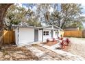 Stylish home featuring a fresh exterior and updated landscaping for enhanced curb appeal at 9607 N 13Th St, Tampa, FL 33612