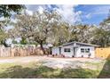 Charming single-story home with fresh exterior paint and landscaped front yard at 9607 N 13Th St, Tampa, FL 33612