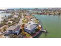 Home's prime waterfront location offers scenic views and easy access to boating and water activities at 13 Bellevue Dr, Treasure Island, FL 33706