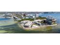 Waterfront condos featuring a private pool, landscaping, and water views at 2506 N Rocky Point Dr # 242, Tampa, FL 33607