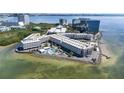 Panoramic aerial view of the condos with lush landscaping and private pool at 2506 N Rocky Point Dr # 242, Tampa, FL 33607
