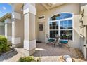 Inviting front porch with seating area and decorative details at 3530 Birkdale Ln, Palm Harbor, FL 34684