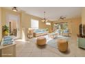 Bright, staged living room with a comfortable seating arrangement and stylish decor at 4216 Preserve Pl, Palm Harbor, FL 34685