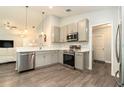 Beautiful modern kitchen equipped with stainless steel appliances and plenty of counter space for cooking at 6863 Hanworth Ln, Zephyrhills, FL 33541