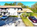 Charming two-story townhouse with a well-manicured lawn and convenient parking spaces at 10131 Lake Oak Cir, Tampa, FL 33624
