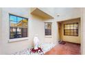 Charming courtyard featuring a statue, decorative stones, and access to the front door at 10488 Saint Tropez Pl, Tampa, FL 33615
