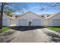 Detached garages with individual doors, providing secure parking and extra storage space for residents at 1400 Water View W Dr # 102, Largo, FL 33771
