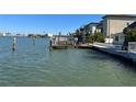 Beautiful waterfront featuring a private dock and seawall at 16217 Redington Dr, Redington Beach, FL 33708