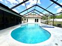 Inviting screened-in pool and spa, ideal for relaxing and entertaining in a private backyard setting at 1811 Tawnee Pl, Brandon, FL 33510