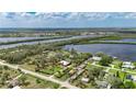 Sprawling waterfront property with lush greenery, showcasing a beautiful home and serene river views at 2307 7Th Sw St, Ruskin, FL 33570