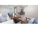 This beautiful living room features tile floors, neutral paint and comfortable furniture at 350 51St N Ave, St Petersburg, FL 33703