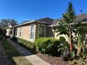 Attractive single story home with lush landscaping and well-maintained lawn at 8603 Egret Point Ct, Tampa, FL 33647