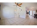 Bright living room with tile flooring, a ceiling fan, and crown molding at 8792 93Rd St, Seminole, FL 33777