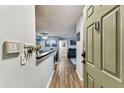 Inviting foyer with a wood floor, dining area, and open view into the living room at 9481 Highland Oak Dr # 404, Tampa, FL 33647