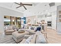 Inviting open-concept living area with comfortable seating, modern décor, and seamless access to the outdoor living space at 809 Seascape Pl, Sarasota, FL 34240