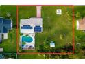 Expansive .42 acre lot with a pool, patio area, and solar panels on roof at 15099 Community Ave, Port Charlotte, FL 33953