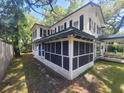 Side of house showing the screened in porch at 5121 40Th N Ave, St Petersburg, FL 33709