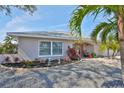 Charming home featuring a well-maintained lawn, mature landscaping and flowering plants at 6324 Balboa Ln, Apollo Beach, FL 33572