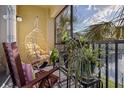 Comfortable screened patio with hanging chair offering peaceful outdoor living at 10201 Courtney Palms Blvd # 204, Tampa, FL 33619