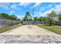 Covered pool area in backyard needing TLC at 12704 128Th Ln, Largo, FL 33774