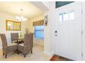 Inviting dining area with elegant furnishings and natural light from the front door window at 27941 Austin Woods Dr, Dade City, FL 33525