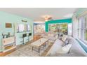 Inviting living room features wood floors and plenty of natural light at 300 Promenade Dr # 106, Dunedin, FL 34698
