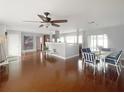 Spacious dining area with a ceiling fan and views into the living room and kitchen at 4301 50Th S Ter, St Petersburg, FL 33711