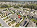 Aerial view of neighborhood showing the house in the foreground with a pond visible in the background at 10967 Carlton Fields Dr, Riverview, FL 33579