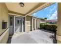 Covered entryway with stylish front door and sidelights offers curb appeal at 1137 54Th S Ave, St Petersburg, FL 33705