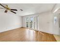 Bright and airy living room with wood floors and large windows at 1137 54Th S Ave, St Petersburg, FL 33705