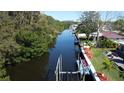 View of the waterfront canal and boat lift, providing convenient access to waterways and picturesque scenery at 201 79Th Ne Ave, St Petersburg, FL 33702