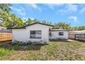 View of the home's backyard, including partial fencing and home's architectural details at 3553 34Th N Ave, St Petersburg, FL 33713
