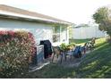 Inviting backyard patio with comfortable seating, perfect for outdoor dining and relaxation at 411 Bloom Ct # 2A, Sun City Center, FL 33573