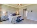 Comfortable bedroom with a plush bed, stylish side tables, soft lighting, and a serene atmosphere at 10523 Farm Hill Ave, Land O Lakes, FL 34638