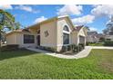 Attractive single-story home with a well-maintained lawn and landscaped garden beds at 11321 Copley Ct, Spring Hill, FL 34609