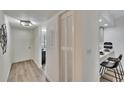 Bright hallway leading to a dining area and kitchen, creating an open and inviting space at 313 Martha Ln # 4, Oldsmar, FL 34677