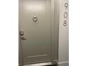 Front entrance to the condo with a modern door and keyless entry system at 400 Island Way # 908, Clearwater Beach, FL 33767