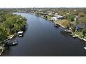Stunning aerial view of waterfront property with private docks and lush landscaping at 4035 N River View Ave, Tampa, FL 33607