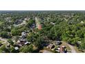 Explore a sprawling neighborhood from above, with the highlighted property nestled among lush trees at 500 Hillpine Way, Brandon, FL 33510