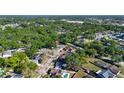Aerial view of the neighborhood, with a highlighted property among lush trees and surrounding homes at 500 Hillpine Way, Brandon, FL 33510