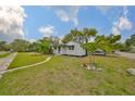 Landscaped yard with stepping stone pathway leading up to home at 5601 2Nd N Ave, St Petersburg, FL 33710