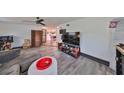 Open-concept living room with modern flooring and entertainment area at 5601 2Nd N Ave, St Petersburg, FL 33710