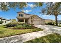Charming two-story home featuring a spacious driveway and well-manicured landscaping at 6308 Bridgevista Dr, Lithia, FL 33547