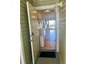 Inviting entrance showcasing view to the interior with neutral flooring and white accents at 6826 Stones Throw N Cir # 11305, St Petersburg, FL 33710