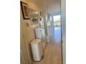 Bright hallway featuring neutral flooring, white accents, and a clear view to the window at 6826 Stones Throw N Cir # 11305, St Petersburg, FL 33710