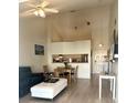 Bright living room featuring vaulted ceilings, tile floors, and a cozy seating area at 6826 Stones Throw N Cir # 11305, St Petersburg, FL 33710