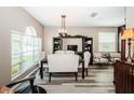 Elegant dining area featuring stylish furniture and natural light, great for Gathering gatherings at 9211 Seeger Ln, Land O Lakes, FL 34638