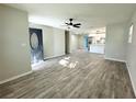 Open-concept living room with a view of the front door and the updated kitchen at 1039 N Missouri Ave, Clearwater, FL 33755