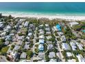 Aerial view of a coastal neighborhood, showcasing the proximity to the beach at 112 79Th St # B, Holmes Beach, FL 34217